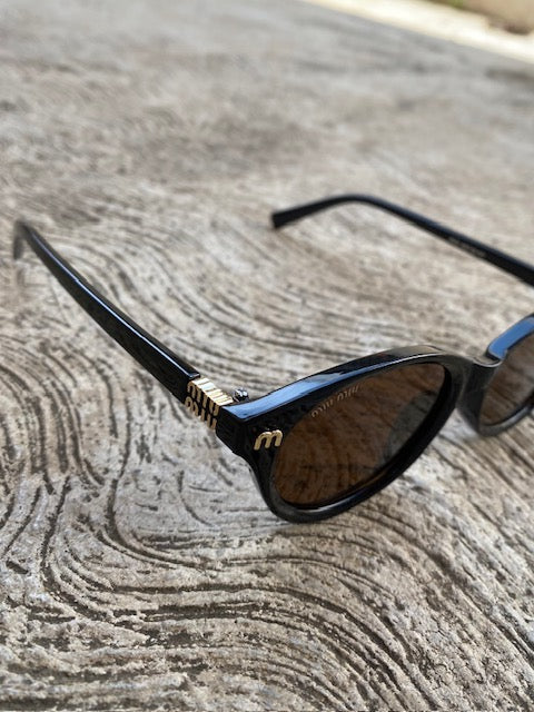 Lentes Miu Miu  Ovalados Cafe con Negro
