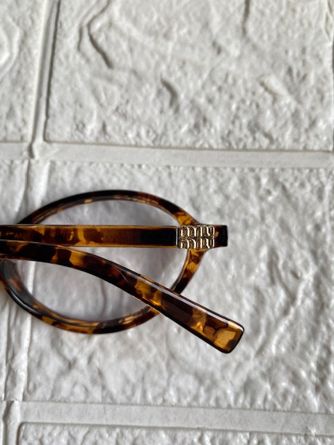 Lentes Miu Miu Ovalados Leopardo con Clear