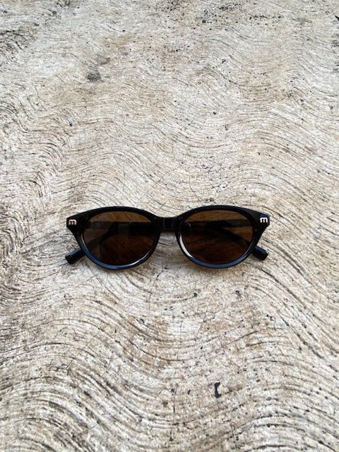 Lentes Miu Miu  Ovalados Cafe con Negro